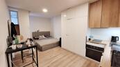 Pronájem, P-10, Strašnice, 1+KK, 22,88 m2, 1.NP/3NP, novostavba, zařízené, cena 13990 CZK / objekt / měsíc, nabízí Michal Němeček