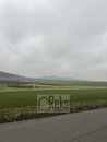 Prodej pozemku Chlustina, cena 1500 CZK / m2, nabízí REKO realitní kancelář